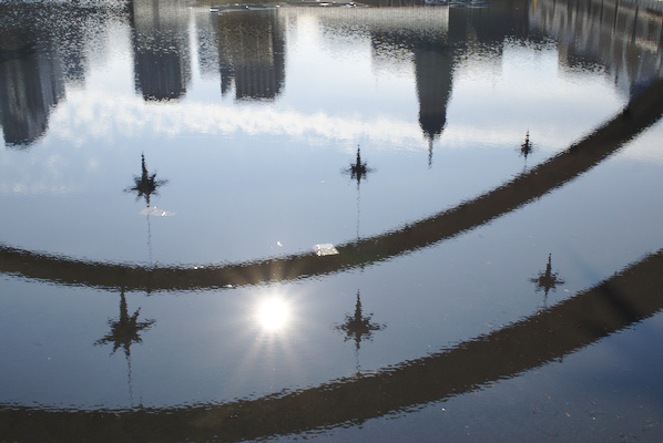 reflection of arches with decorating stars in the pool at Nathan Phillips Square