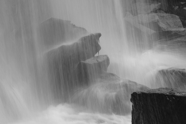 some stones with water from the falls in long exposure