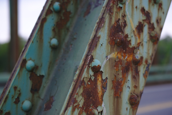 detail of a rusty pillar of a bridge