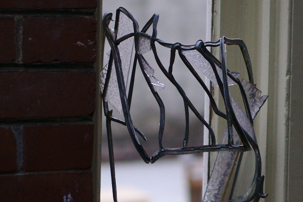 window with broken pieces of glass