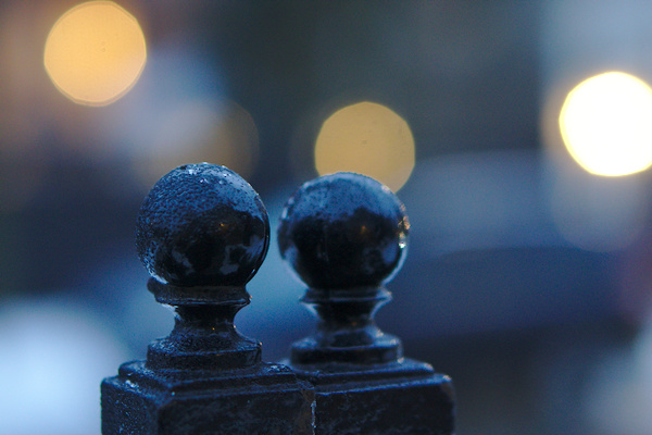 frozen rain drops on the tip of a metall fence