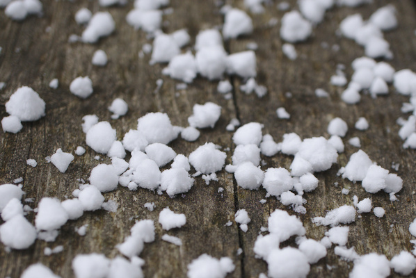 snow pellets on wood