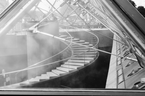 staircase behind glass window